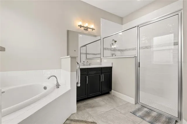 a bathroom with a bathtub and a sink