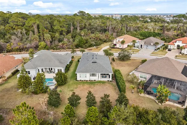 an aerial view of a house with a swimming pool