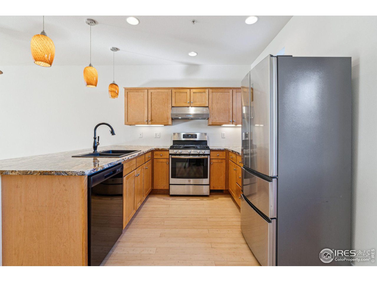 1351 Yellow Pine Avenue Boulder, CO 80304 - Photo 11 of 34 a kitchen with stainless steel appliances granite countertop a stove and a sink