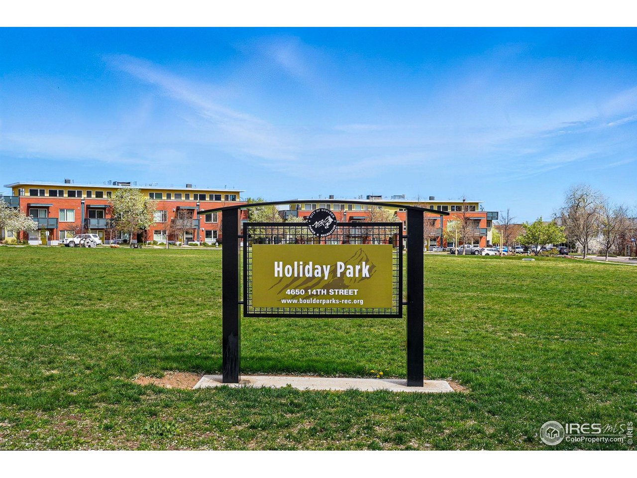 1351 Yellow Pine Avenue Boulder, CO 80304 - Photo 3 of 34 a sign board with view of residential house