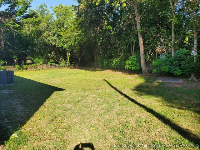 a view of yard with swimming pool