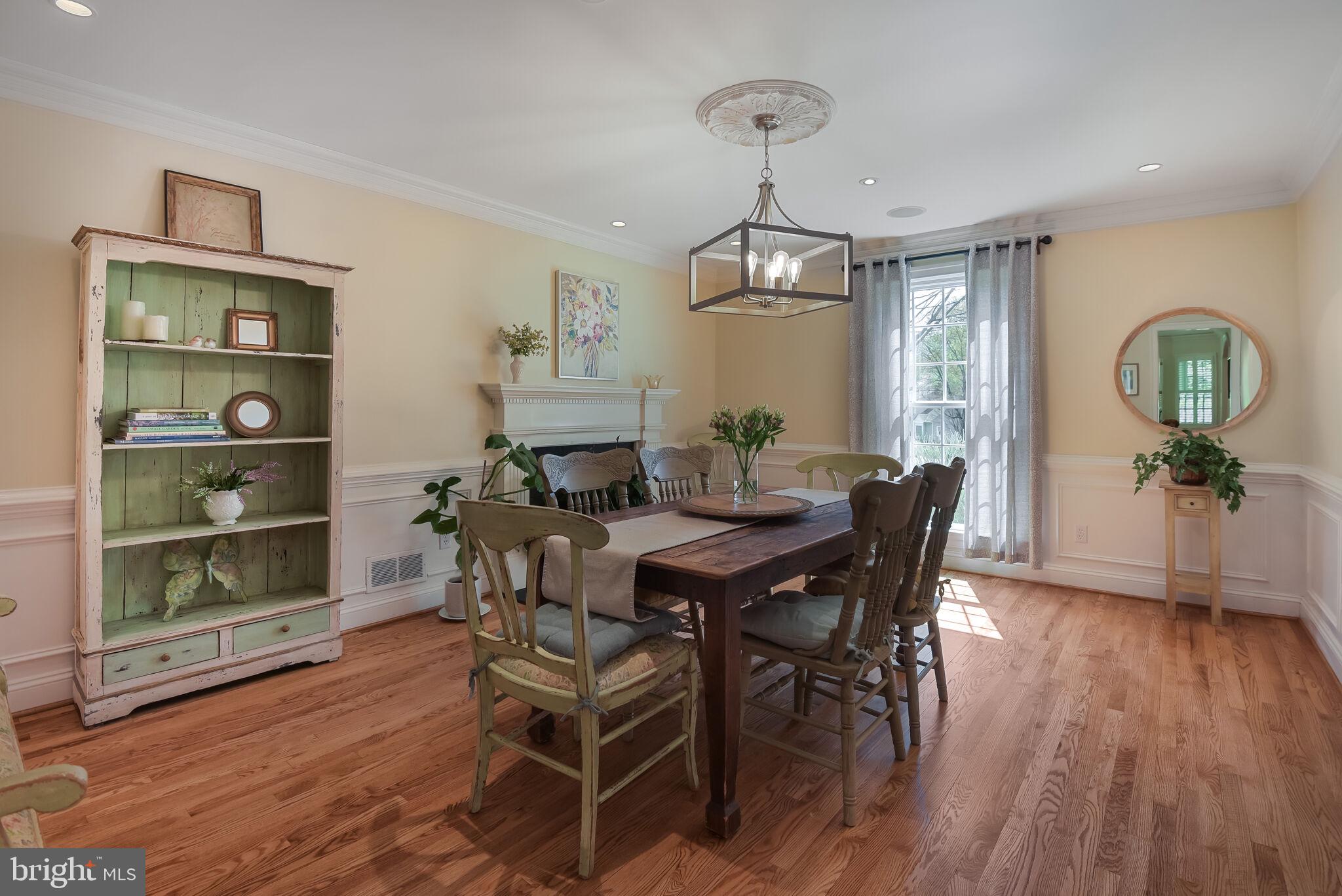10601 Gainsborough Road Potomac, MD 20854 - Photo 16 of 55 a view of a dining room with furniture window and wooden floor