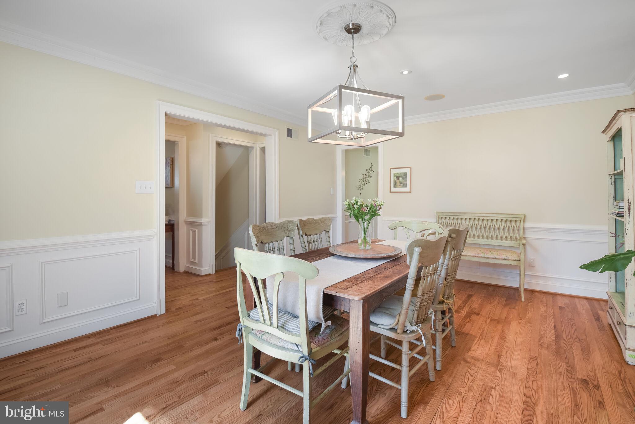 10601 Gainsborough Road Potomac, MD 20854 - Photo 17 of 55 a view of a dining room with furniture wooden floor and chandelier