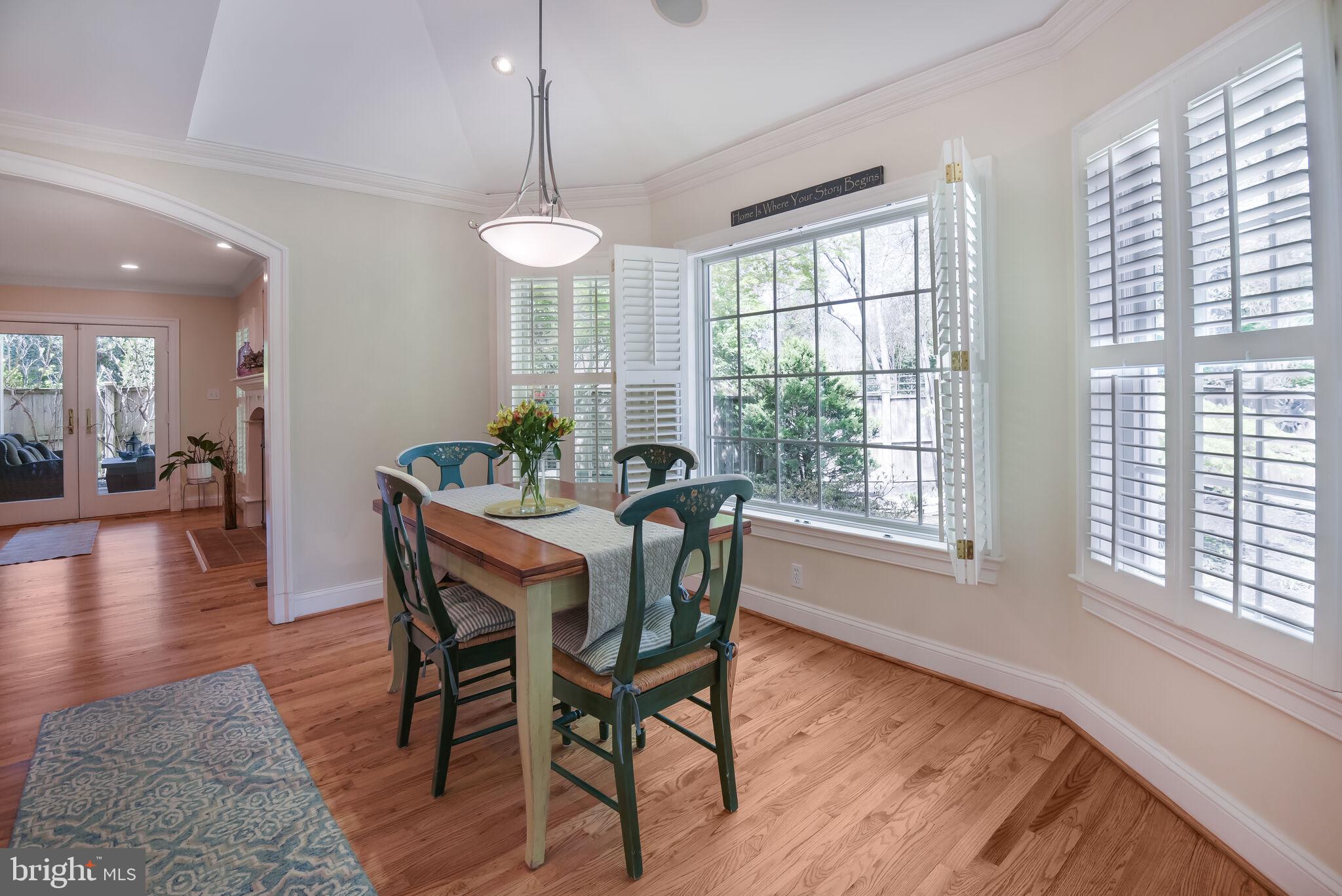 10601 Gainsborough Road Potomac, MD 20854 - Photo 23 of 55 a view of a dining room with furniture window and wooden floor