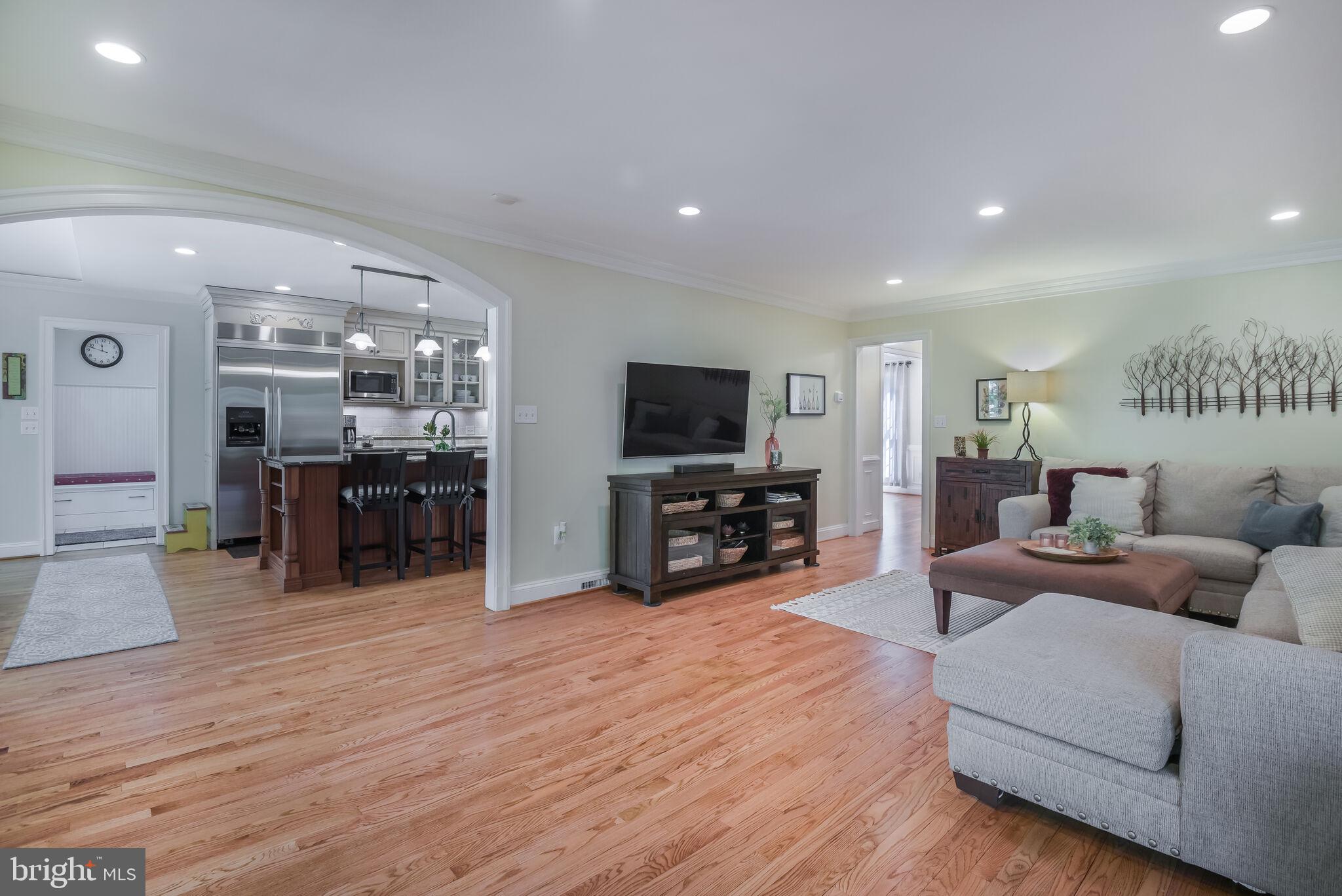 10601 Gainsborough Road Potomac, MD 20854 - Photo 25 of 55 a living room with furniture and a flat screen tv