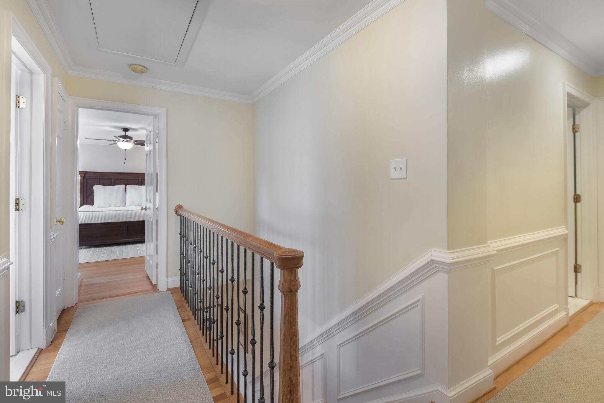 10601 Gainsborough Road Potomac, MD 20854 - Photo 30 of 55 a view of a hallway with white walls and stairs