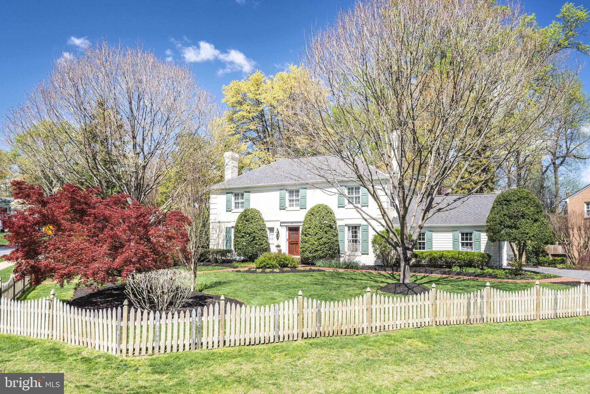10601 Gainsborough Road Potomac, MD 20854 - Photo 3 of 55 a view of a house with a big yard and large trees
