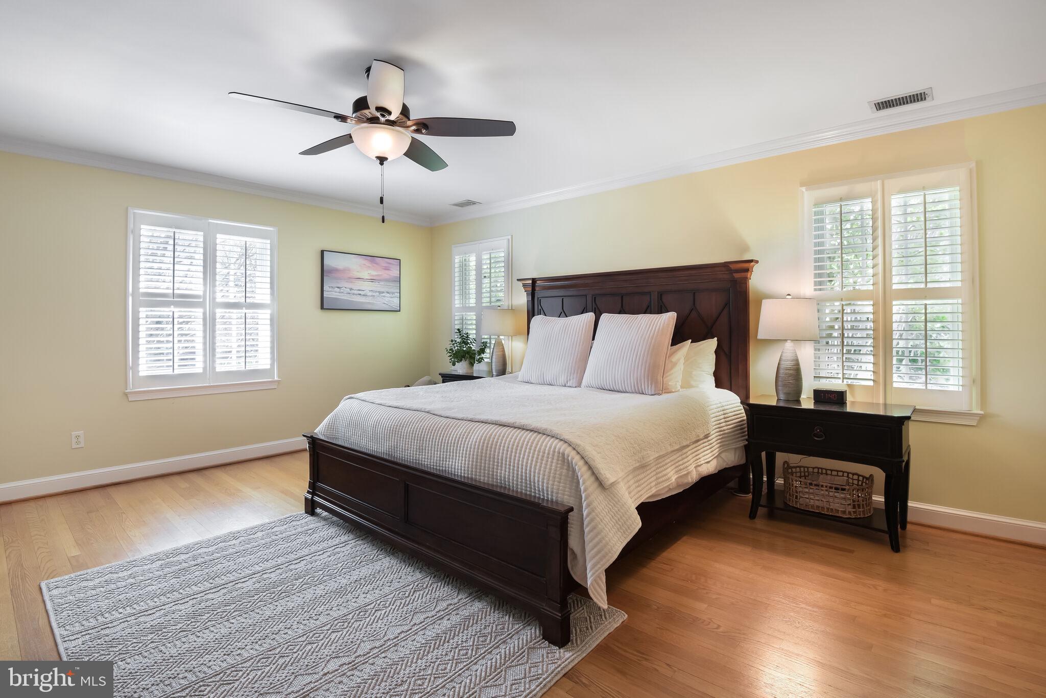 10601 Gainsborough Road Potomac, MD 20854 - Photo 31 of 55 a bedroom with a bed and wooden floor