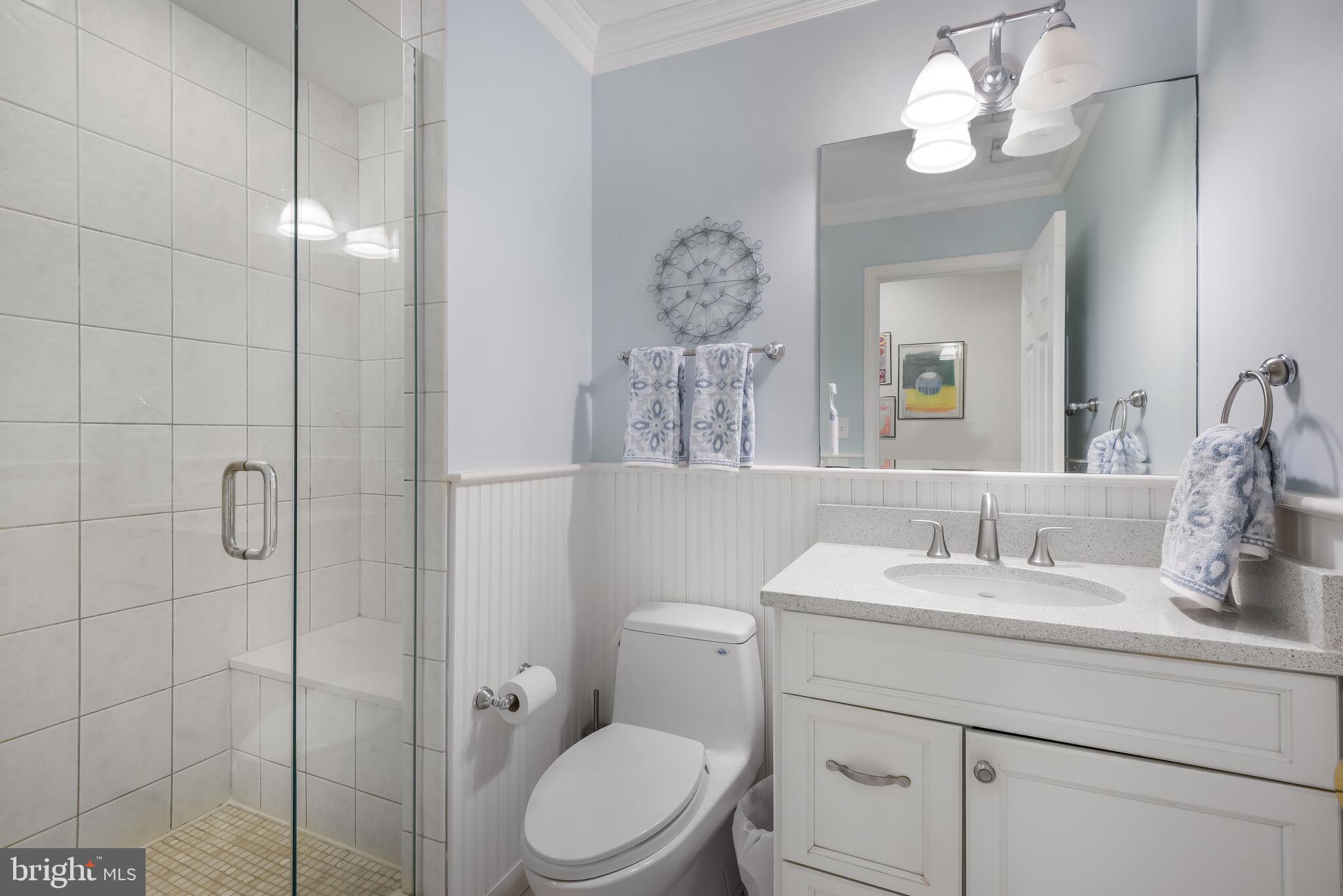 10601 Gainsborough Road Potomac, MD 20854 - Photo 37 of 55 a bathroom with a sink a toilet and a mirror