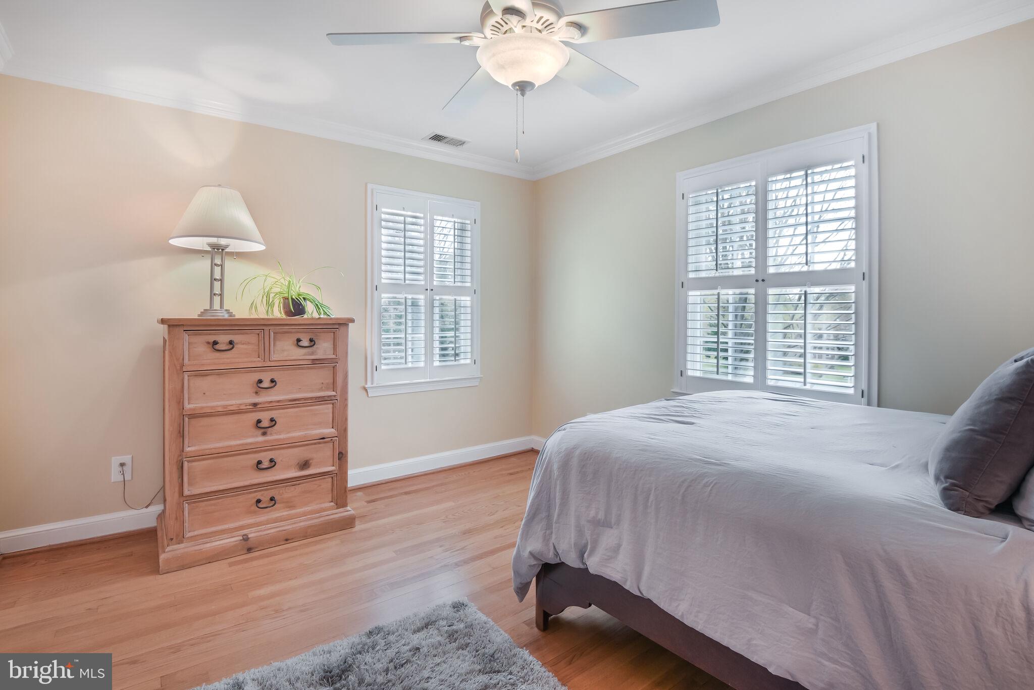 10601 Gainsborough Road Potomac, MD 20854 - Photo 39 of 55 a bedroom with a bed and a dresser
