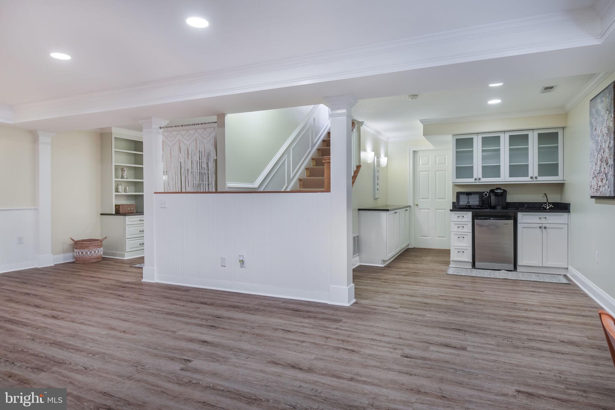 10601 Gainsborough Road Potomac, MD 20854 - Photo 43 of 55 a view of a kitchen cabinets and wooden floor