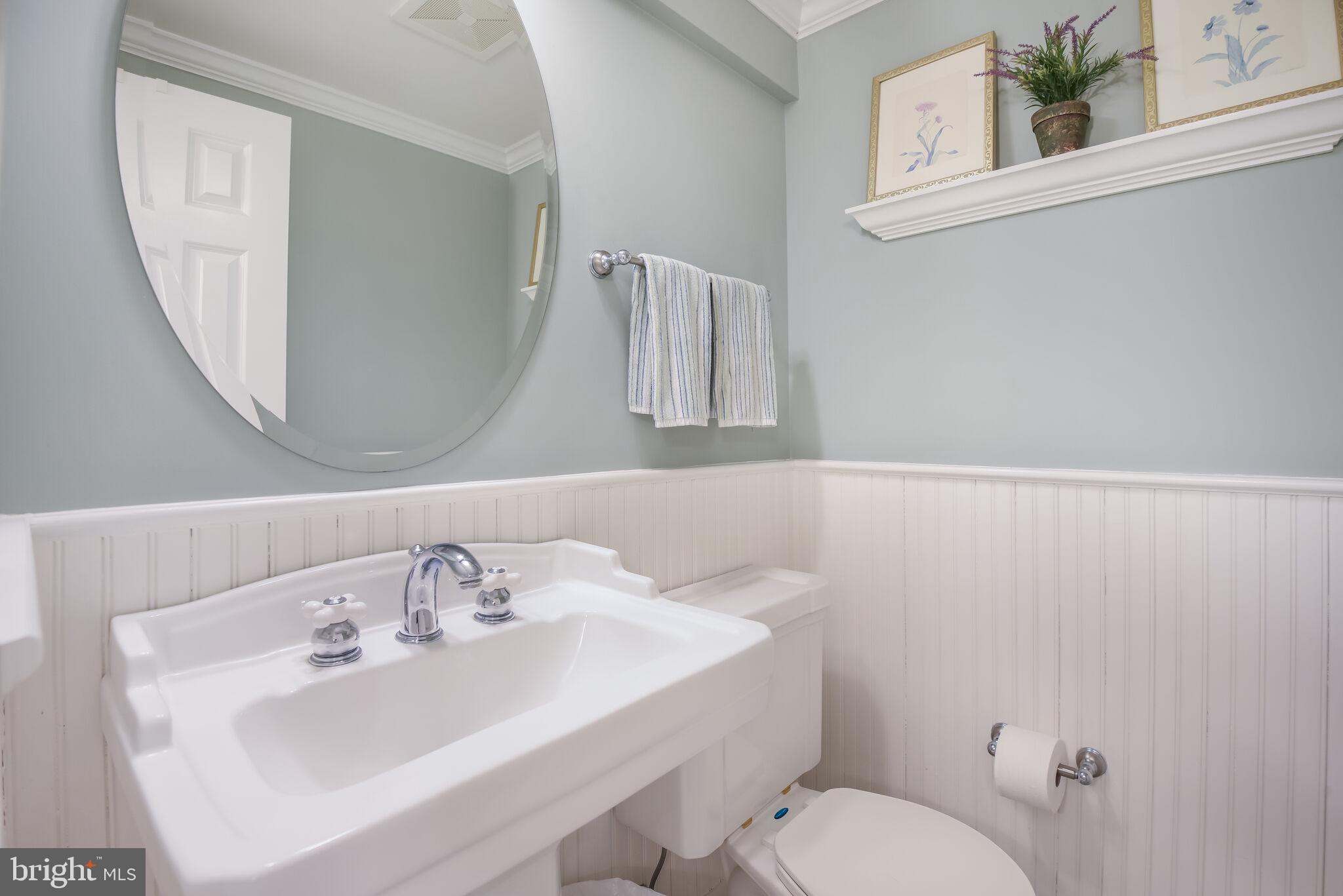 10601 Gainsborough Road Potomac, MD 20854 - Photo 44 of 55 a bathroom with a sink mirror and toilet