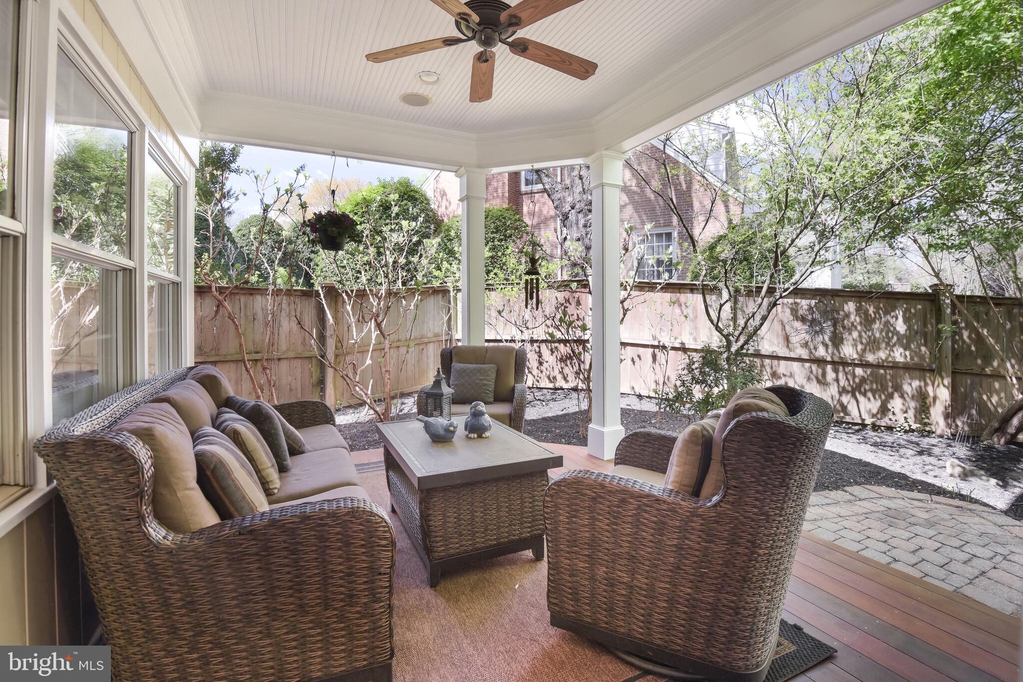 10601 Gainsborough Road Potomac, MD 20854 - Photo 46 of 55 a living room with furniture floor to ceiling window and a table