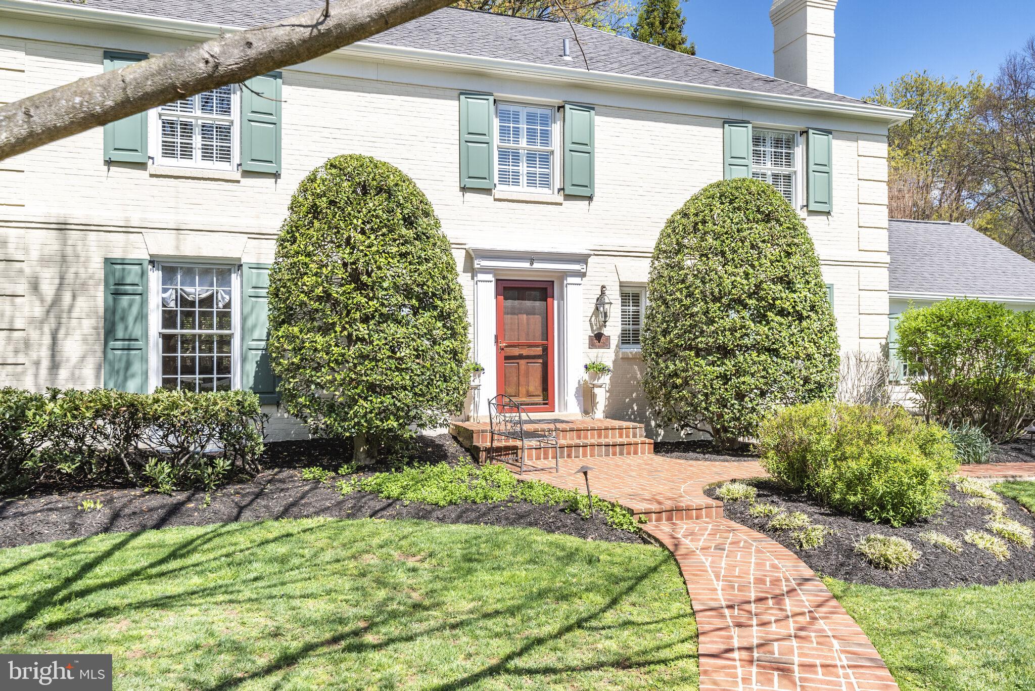 10601 Gainsborough Road Potomac, MD 20854 - Photo 7 of 55 a front view of a house with garden