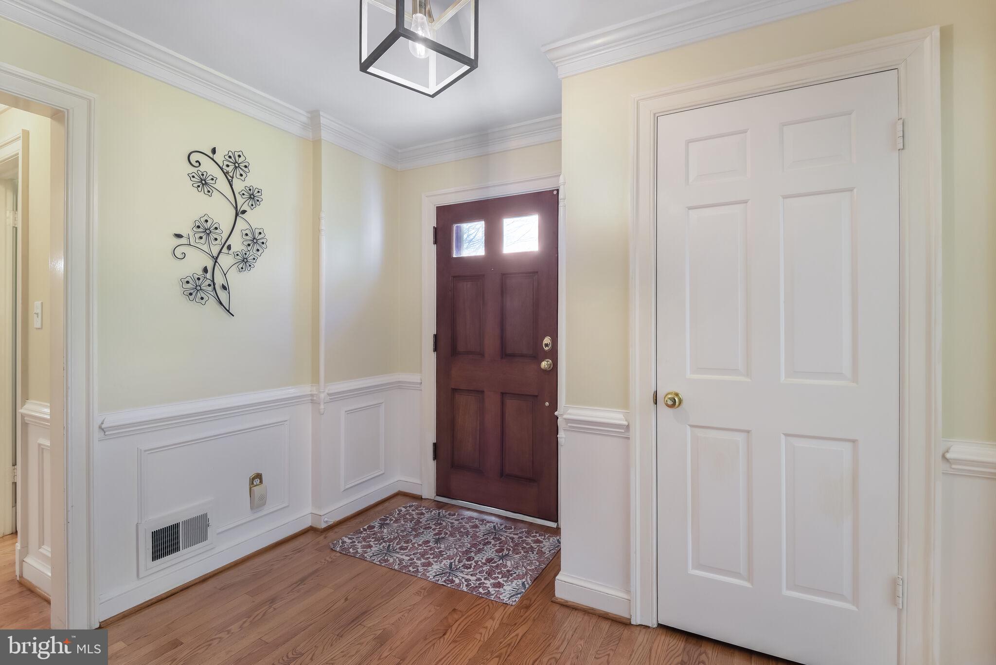 10601 Gainsborough Road Potomac, MD 20854 - Photo 8 of 55 a view of an entryway with wooden floor