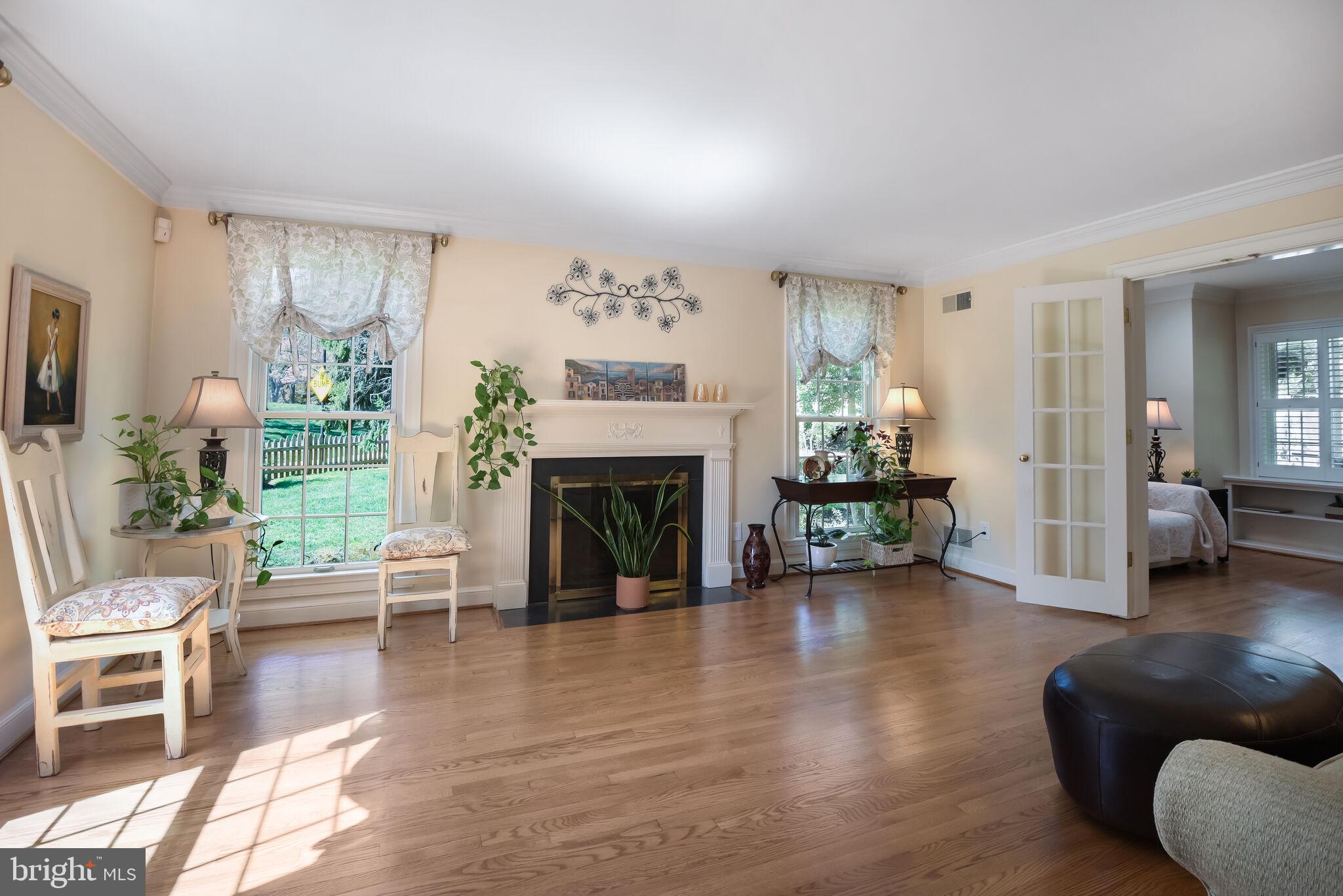 10601 Gainsborough Road Potomac, MD 20854 - Photo 10 of 55 a living room with furniture and a fireplace