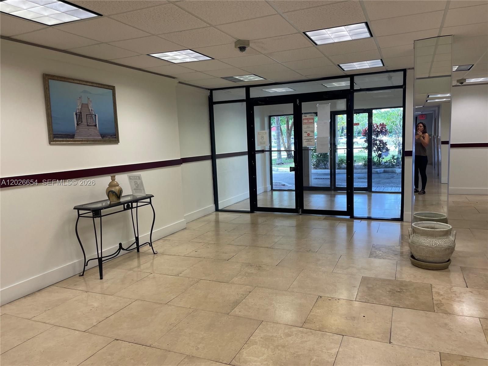 4174 Inverrary Drive, Unit 903 Lauderhill, FL 33319 - Photo 5 of 36 a view of an entryway with wooden floor