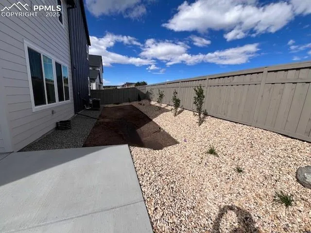 a view of a backyard of the house