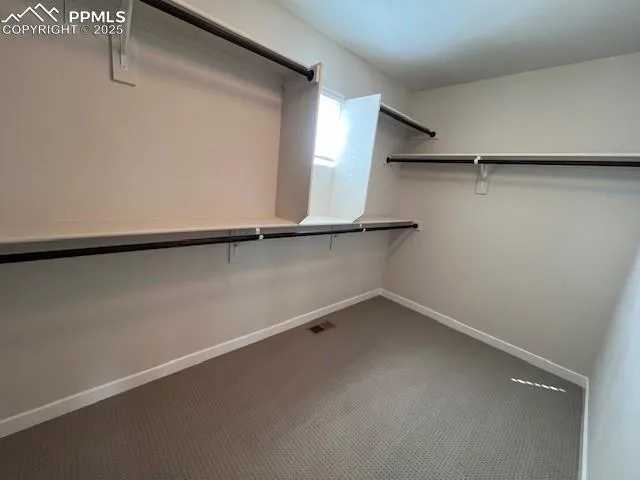 a view of a room with racks on the wall