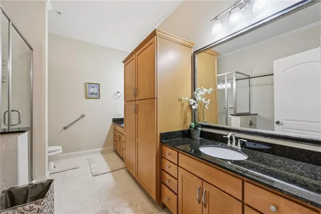 a bathroom with a sink double vanity and a mirror