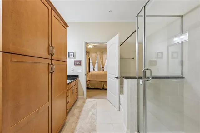 a bathroom with a shower and a sink