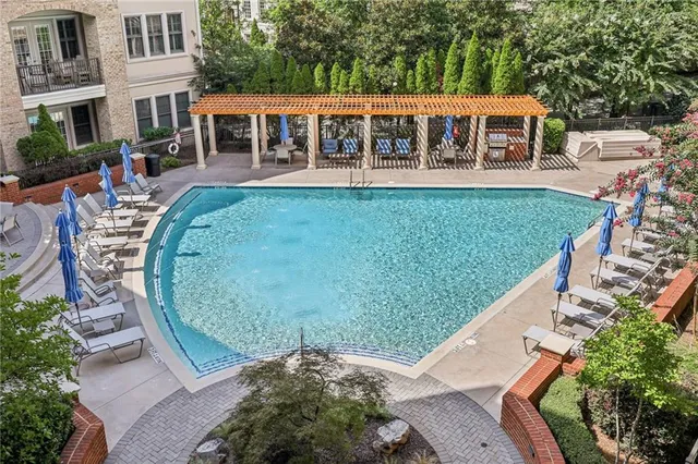 a view of a house with a backyard porch and sitting area