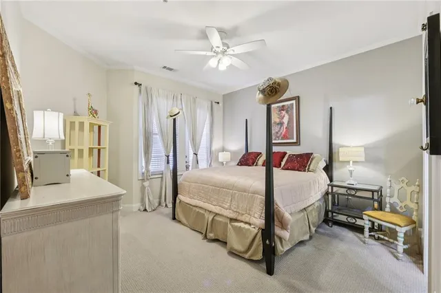 a bed room with a bed and a chandelier