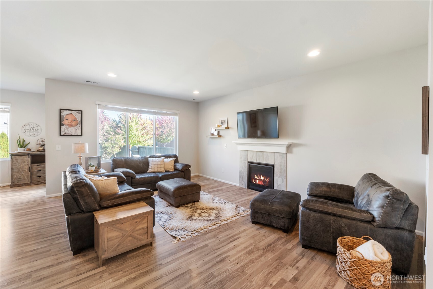 1002 O O'Farrell Lane Northwest Orting, WA 98360 - Photo 16 of 38 a living room with furniture fireplace and a window