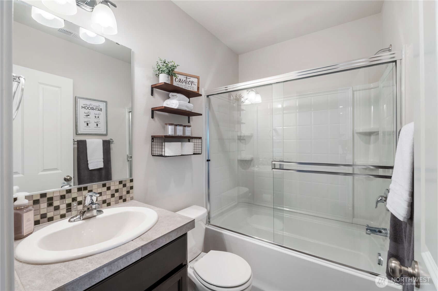 1002 O O'Farrell Lane Northwest Orting, WA 98360 - Photo 18 of 38 a bathroom with a sink toilet and shower