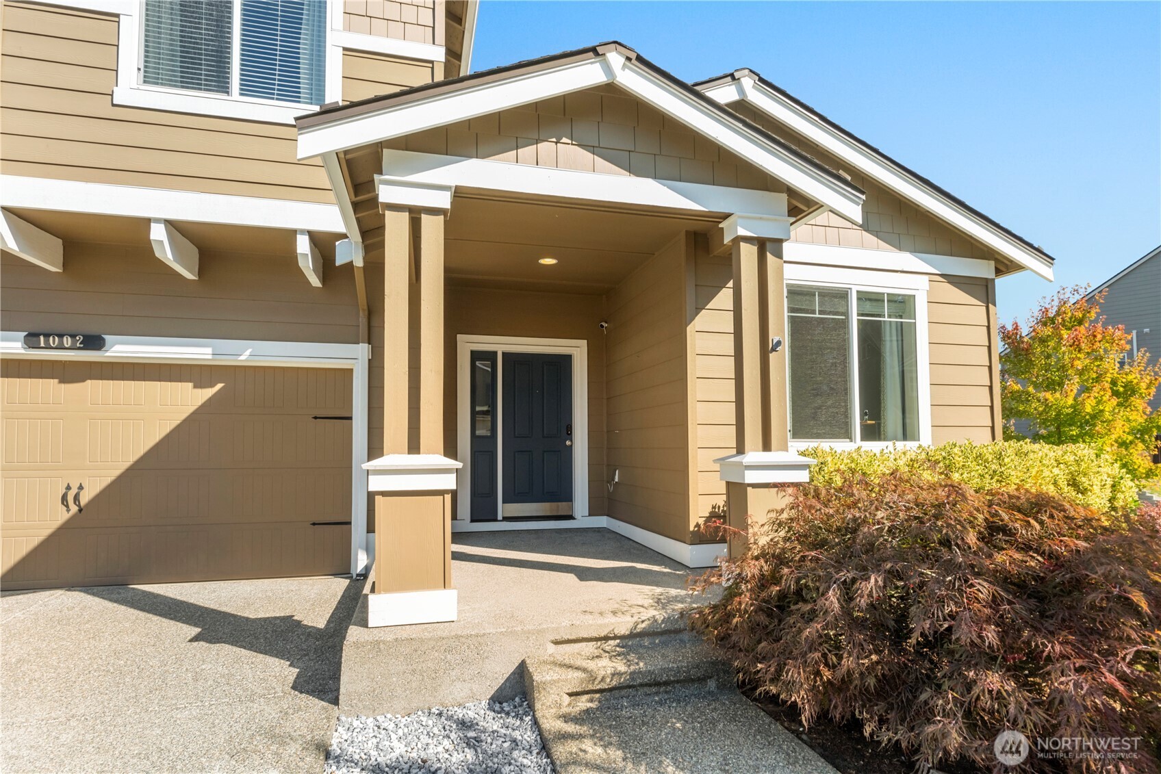 1002 O O'Farrell Lane Northwest Orting, WA 98360 - Photo 2 of 38 a view of a house with a porch