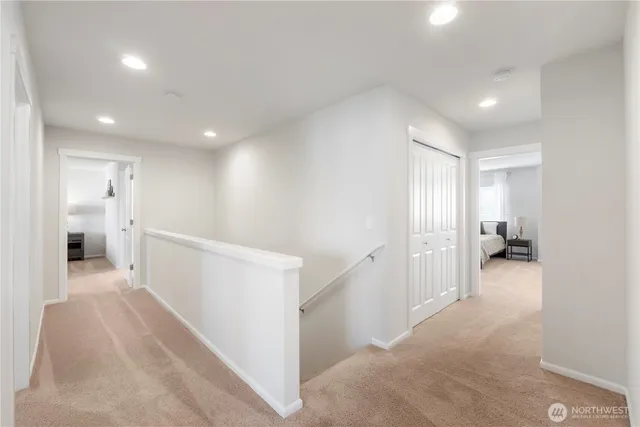 a bathroom with a double vanity sink mirror and bathtub
