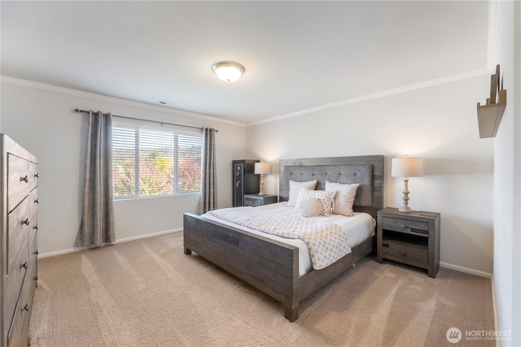 1002 O O'Farrell Lane Northwest Orting, WA 98360 - Photo 22 of 38 a large bedroom with a bed and window