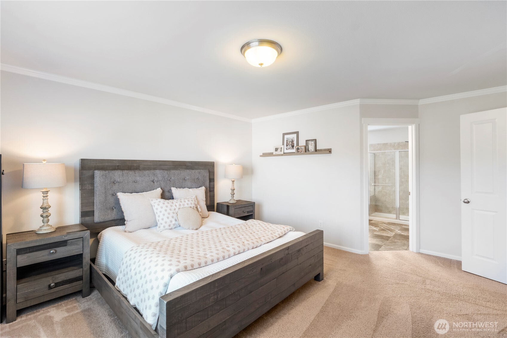 1002 O O'Farrell Lane Northwest Orting, WA 98360 - Photo 23 of 38 a bedroom with a bed and a lamp