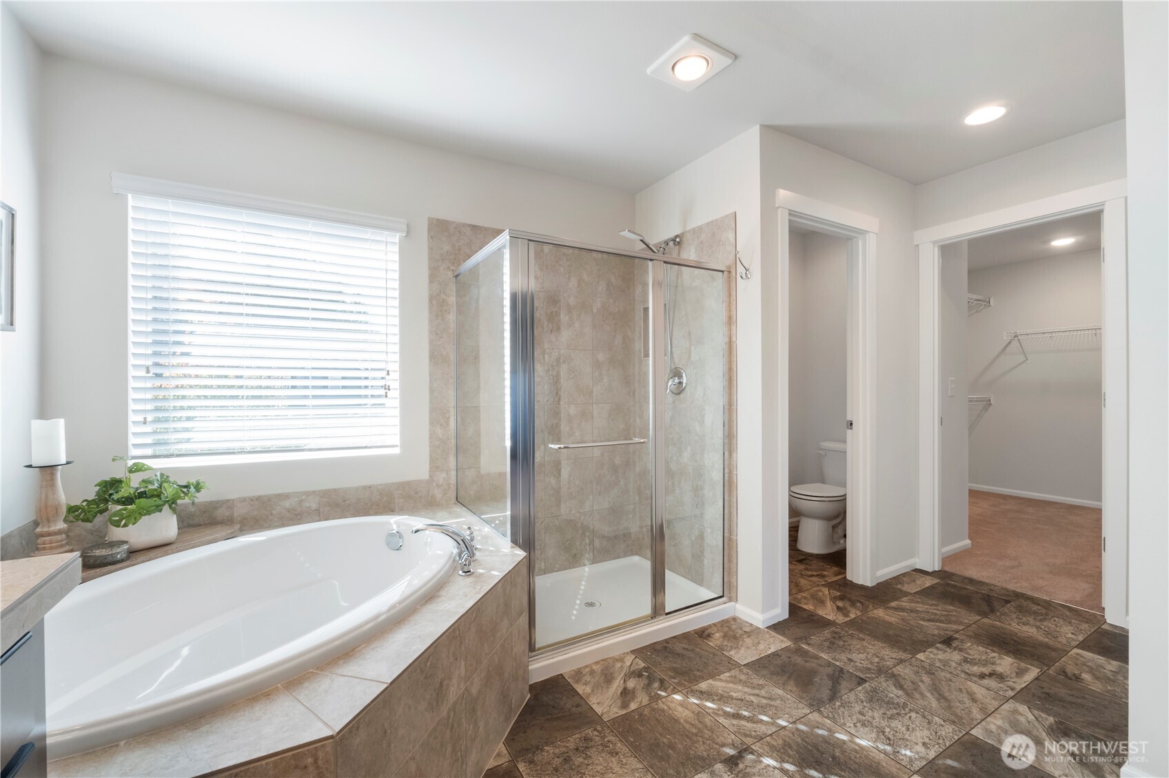 1002 O O'Farrell Lane Northwest Orting, WA 98360 - Photo 25 of 38 a bathroom with a bathtub and a shower