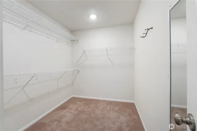 a bathroom with a granite countertop sink toilet a large mirror a bathtub and shower