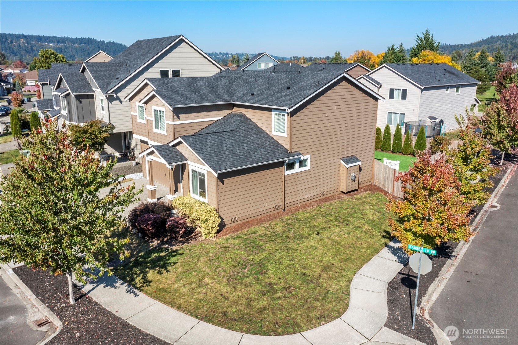 1002 O O'Farrell Lane Northwest Orting, WA 98360 - Photo 35 of 38 a view of a house with a yard and garden