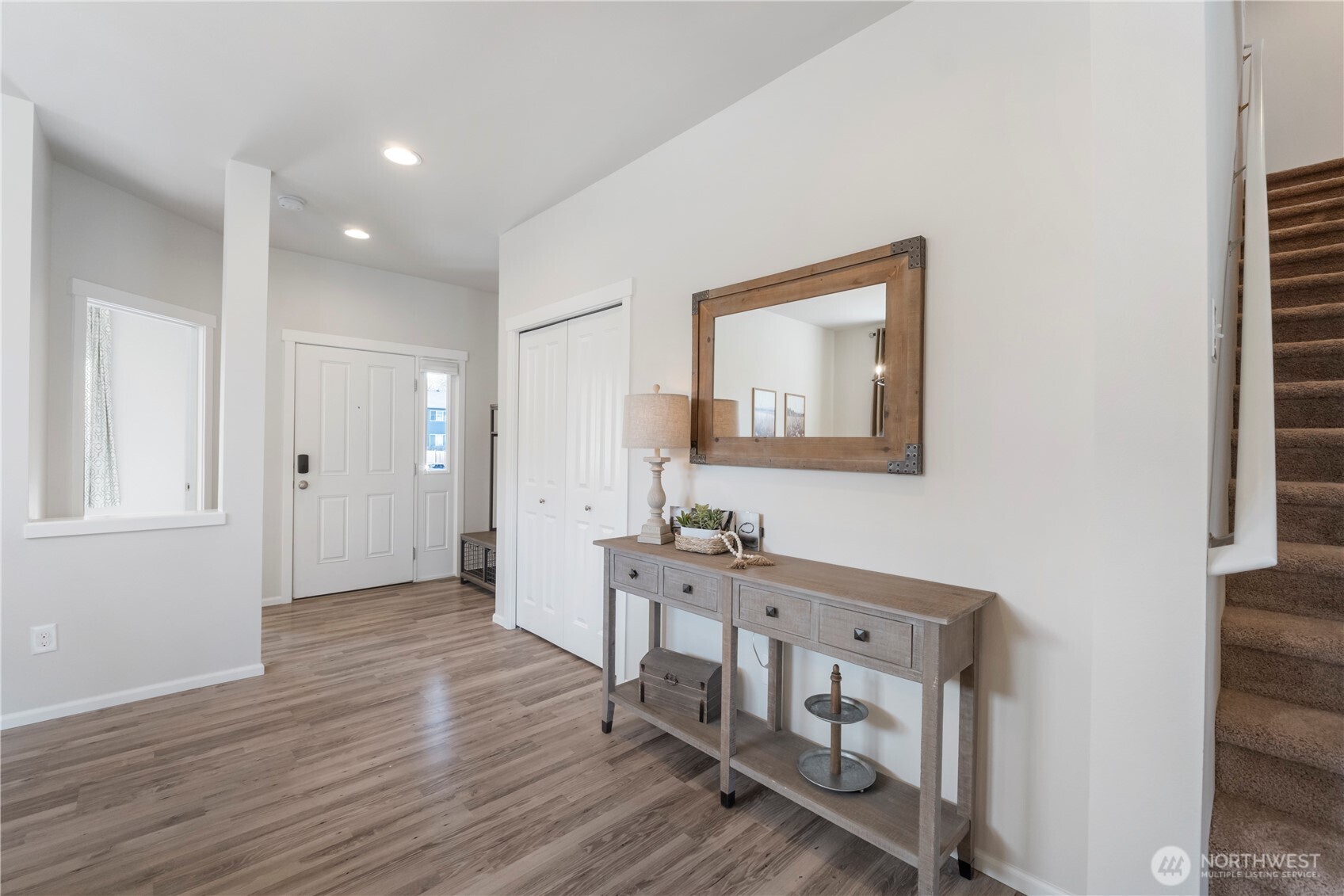 1002 O O'Farrell Lane Northwest Orting, WA 98360 - Photo 8 of 38 a view of livingroom with furniture and wooden floor