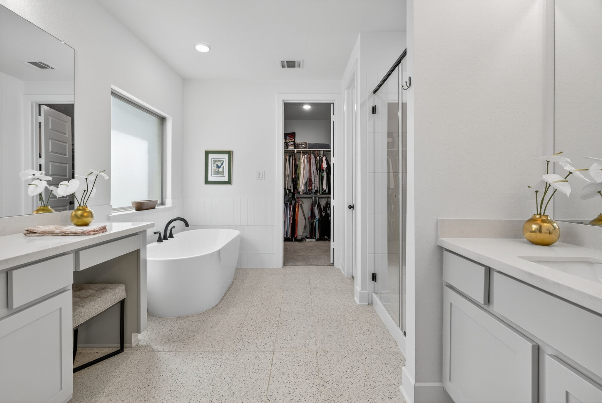 31418 Golden Cliffs Lane Fulshear, TX 77441 - Photo 22 of 48 The Ensuite Primary Bath has quartz countertops, separate vanities, a soaking garden tub, walk-in shower and tile flooring! 31418 Golden Cliffs Ln., Fulshear, TX 77441