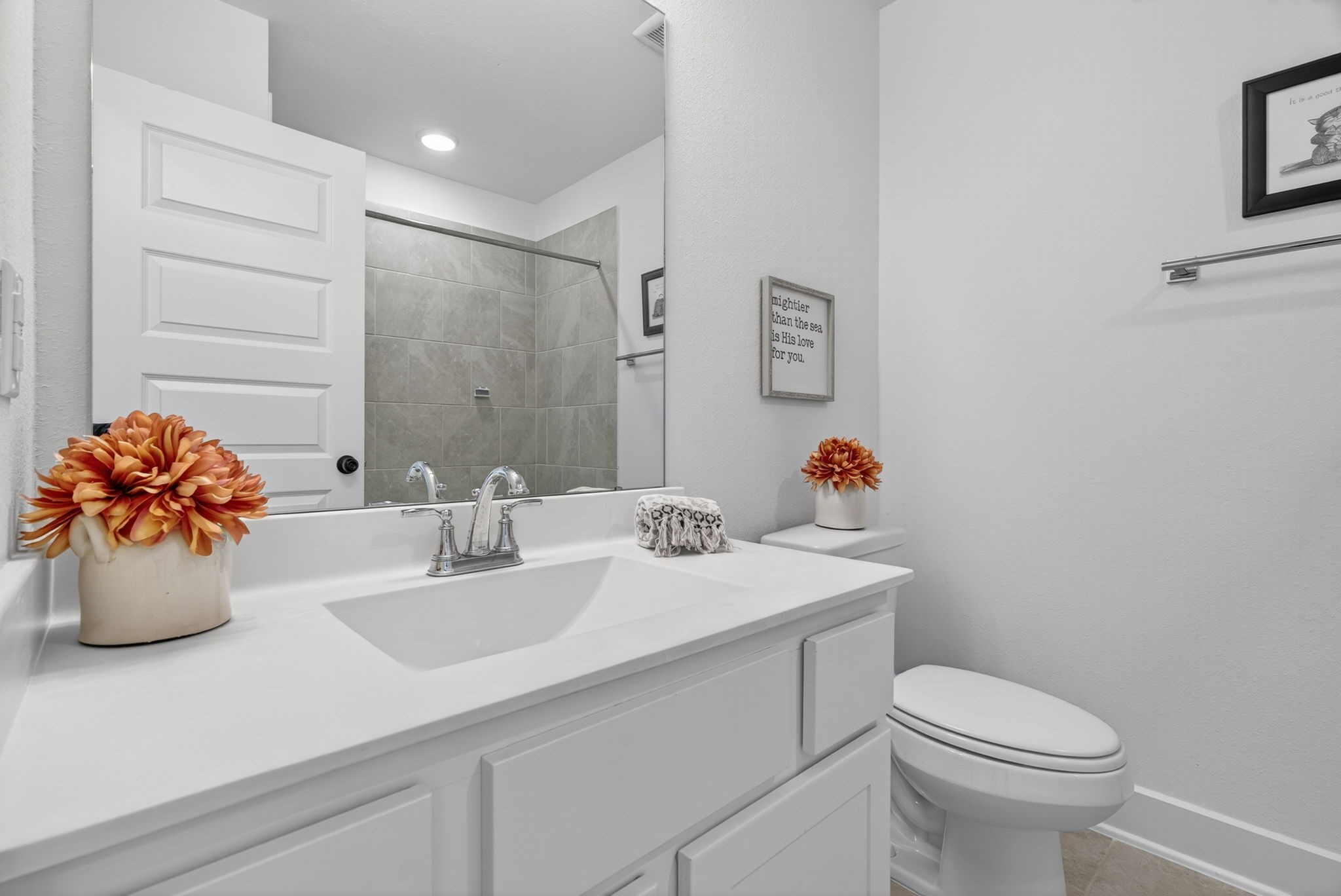 31418 Golden Cliffs Lane Fulshear, TX 77441 - Photo 32 of 48 a bathroom with a sink toilet and a mirror