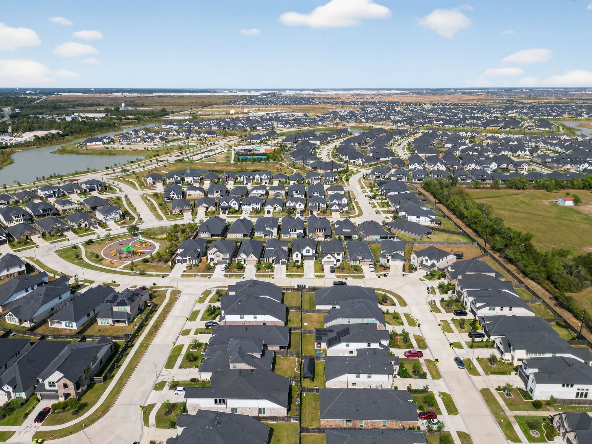 31418 Golden Cliffs Lane Fulshear, TX 77441 - Photo 41 of 48 an aerial view of residential building and lake