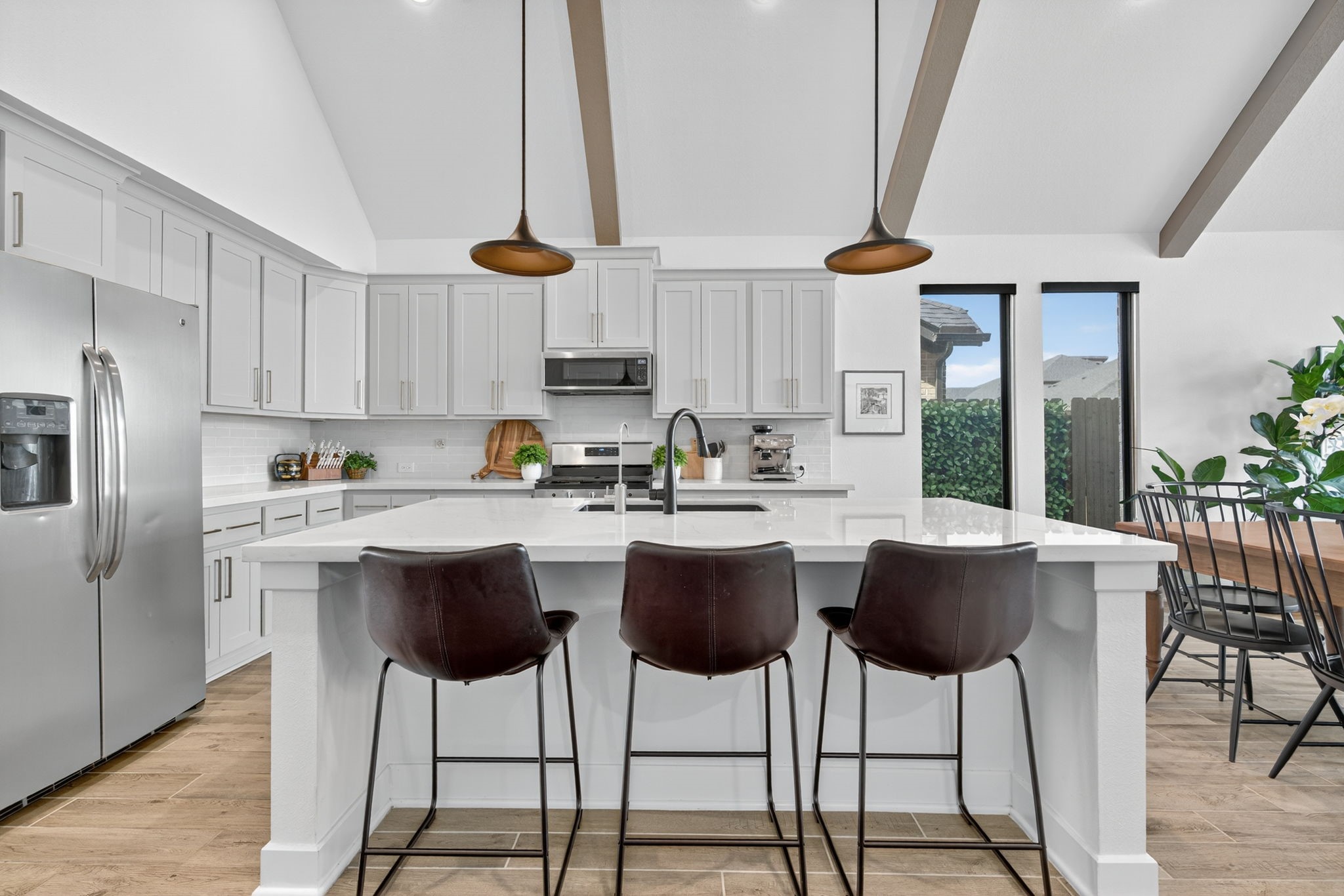 31418 Golden Cliffs Lane Fulshear, TX 77441 - Photo 5 of 48 Your family & friends can join you while seated at the island as you prepare delicious entrees. The stainless steel appliances complete the kitchen to perfection! 31418 Golden Cliffs Ln., Fulshear, TX 77441
