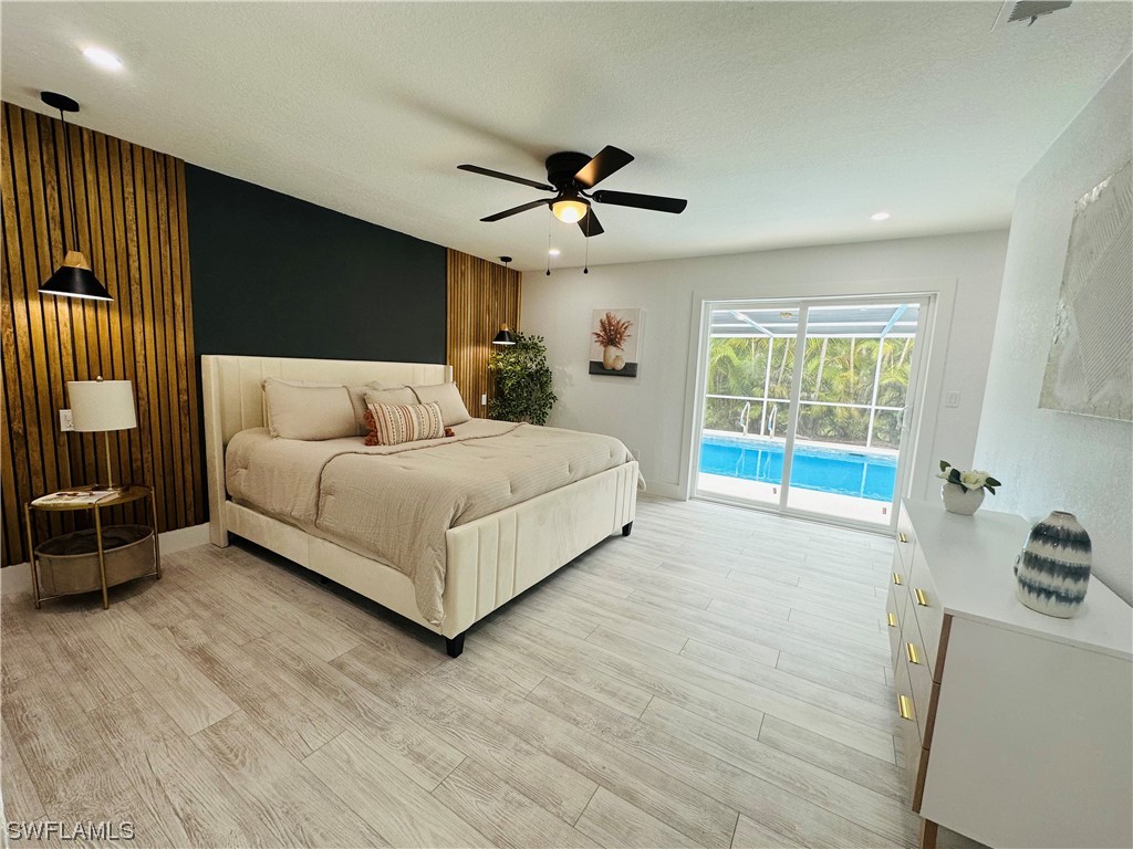2926 Holly Road Fort Myers, FL 33901 - Photo 1 of 47 a living room with furniture and a large window