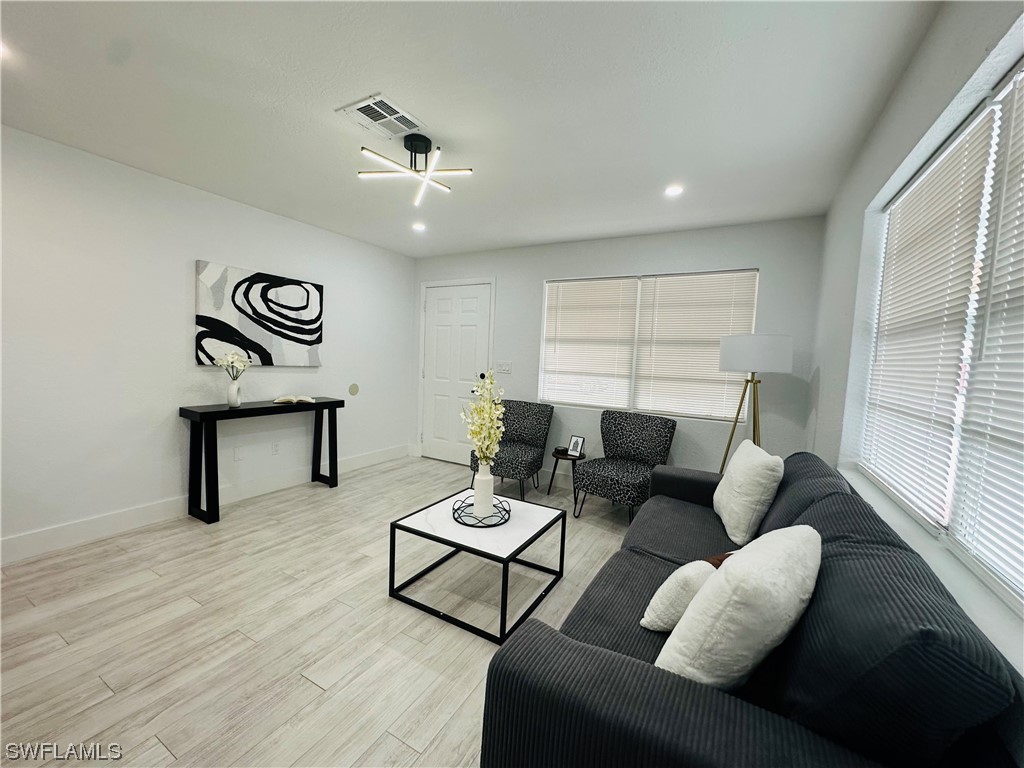 2926 Holly Road Fort Myers, FL 33901 - Photo 11 of 47 a living room with furniture and a window