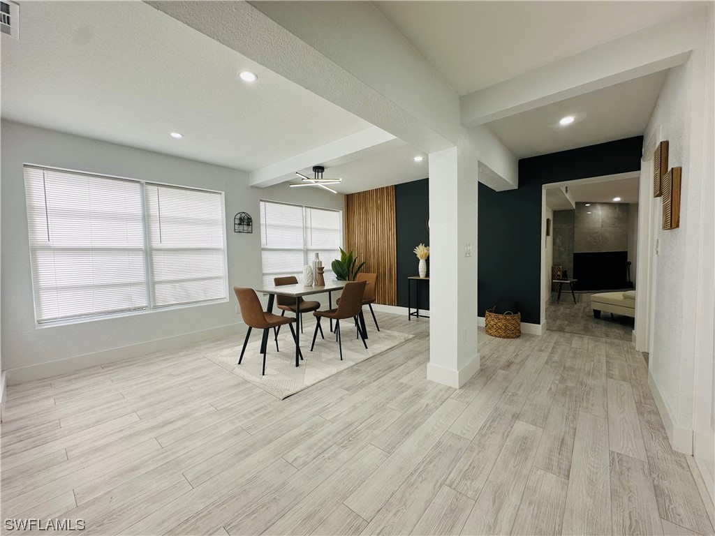 2926 Holly Road Fort Myers, FL 33901 - Photo 16 of 47 a view of a room with furniture and wooden floor