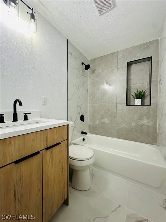2926 Holly Road Fort Myers, FL 33901 - Photo 22 of 47 a bathroom with a sink a toilet and shower