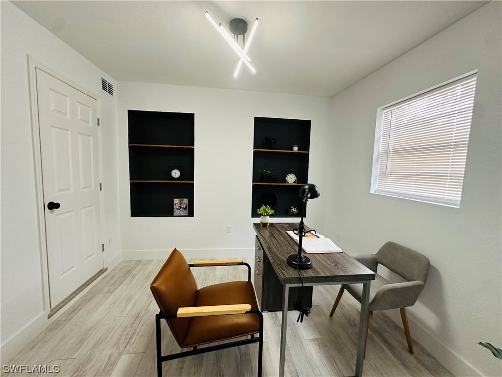 2926 Holly Road Fort Myers, FL 33901 - Photo 25 of 47 a workspace with furniture and window