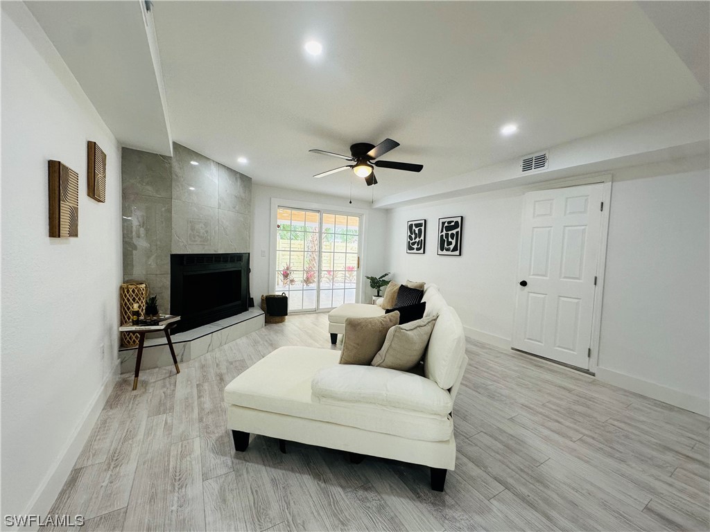 2926 Holly Road Fort Myers, FL 33901 - Photo 28 of 47 a living room with furniture and a flat screen tv