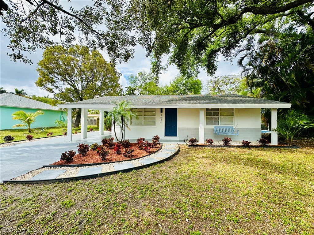 2926 Holly Road Fort Myers, FL 33901 - Photo 3 of 47 a view of a house with swimming pool and sitting area