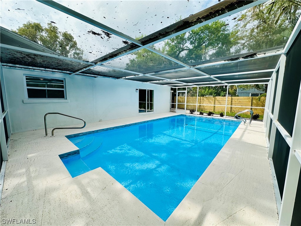 2926 Holly Road Fort Myers, FL 33901 - Photo 38 of 47 a view of swimming pool with seating area