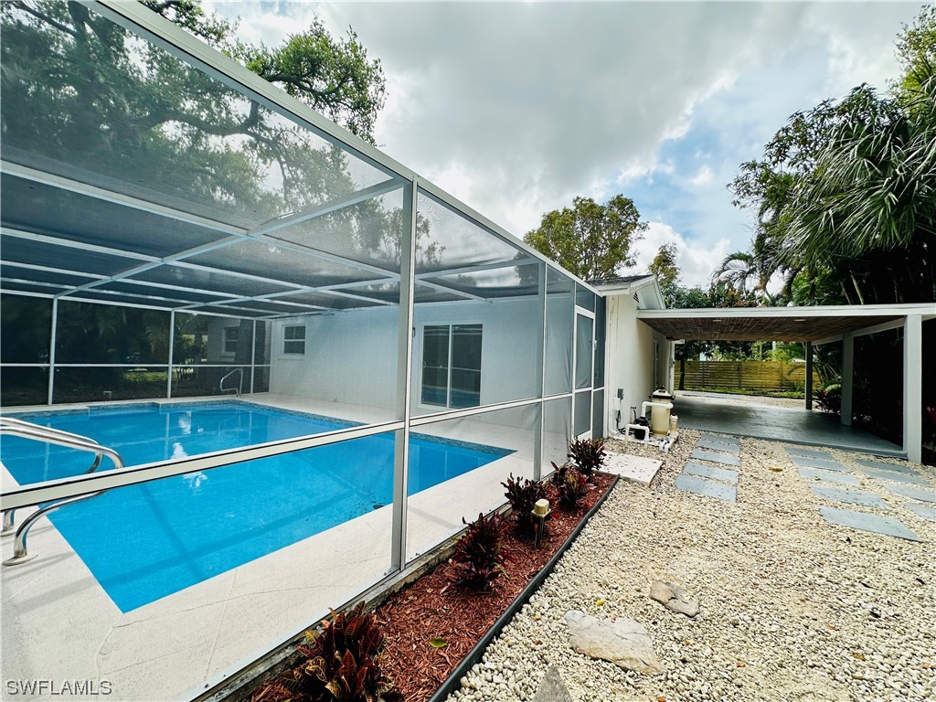 2926 Holly Road Fort Myers, FL 33901 - Photo 39 of 47 a view of house with backyard and furniture